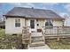 House exterior showcasing a deck and landscaping at 6348 Kingsley Dr, Indianapolis, IN 46220