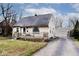 House exterior with a detached garage and front yard at 6348 Kingsley Dr, Indianapolis, IN 46220