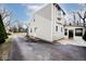 Rear exterior view of house with tan vinyl siding and a patio at 6348 Kingsley Dr, Indianapolis, IN 46220