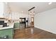 Bright kitchen features stainless steel appliances and green cabinets at 6348 Kingsley Dr, Indianapolis, IN 46220