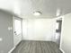 Small pantry with white cabinets and wood-look floors at 810 W 2Nd St, Anderson, IN 46016