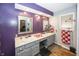 Bathroom with double vanity and purple walls at 965 W New Rd, Greenfield, IN 46140