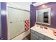 Bathroom with shower/tub combo and purple walls at 965 W New Rd, Greenfield, IN 46140