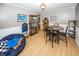 Dining area with hardwood floors, round table, and four chairs at 965 W New Rd, Greenfield, IN 46140