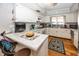Kitchen with white cabinets, stainless steel appliances, and breakfast bar at 965 W New Rd, Greenfield, IN 46140