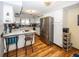 Kitchen with white cabinets, stainless steel appliances, and breakfast bar at 965 W New Rd, Greenfield, IN 46140