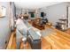 Living room with hardwood floors, stone fireplace, and comfortable gray couch at 965 W New Rd, Greenfield, IN 46140
