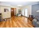 Bright living room with hardwood floors and access to backyard patio at 965 W New Rd, Greenfield, IN 46140