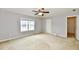 Bright bedroom featuring a large window and walk-in closet at 9653 Calamus Dr, Noblesville, IN 46060