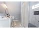 Modern bathroom with a walk-in shower and double vanity at 209 Trowbridge St, Indianapolis, IN 46201