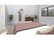 Cozy bedroom with a queen-size bed and access to a walk-in closet at 209 Trowbridge St, Indianapolis, IN 46201