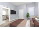 Bedroom with a queen-size bed and access to another room at 209 Trowbridge St, Indianapolis, IN 46201