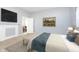 Bedroom with a queen bed and access to the living room at 209 Trowbridge St, Indianapolis, IN 46201