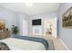 Main bedroom with TV, fireplace, and access to another room at 209 Trowbridge St, Indianapolis, IN 46201
