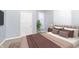 Bedroom with a queen bed and neutral-toned bedding at 209 Trowbridge St, Indianapolis, IN 46201