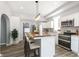 Modern kitchen with white cabinets, wood island, and stainless steel appliances at 209 Trowbridge St, Indianapolis, IN 46201