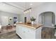 Modern kitchen with white cabinets and a wood island at 209 Trowbridge St, Indianapolis, IN 46201