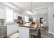 Modern kitchen with white cabinets and a kitchen island at 209 Trowbridge St, Indianapolis, IN 46201