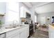 Modern kitchen features stainless steel appliances and granite countertops at 209 Trowbridge St, Indianapolis, IN 46201