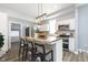 Modern kitchen with white cabinets and a large kitchen island at 209 Trowbridge St, Indianapolis, IN 46201