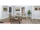 Living room with two armchairs and a view of a bedroom at 209 Trowbridge St, Indianapolis, IN 46201