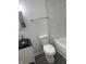 Modern bathroom with marble tile and a white toilet at 2321 W 26Th St, Anderson, IN 46016