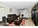 Living room with leather furniture, coffee table, and area rug at 4961 Oakbrook Dr # A1, Indianapolis, IN 46254