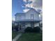 Classic two-story home featuring a covered front porch, brick accents, and a well-maintained lawn at 1024 S Tremont St, Indianapolis, IN 46221