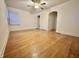 Bright bedroom with hardwood floors and ceiling fan at 1641 Winton Ave, Indianapolis, IN 46224