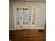 Classic entryway with hardwood floors and white doors at 1641 Winton Ave, Indianapolis, IN 46224
