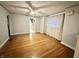 Bright living room with hardwood floors and view into kitchen at 1641 Winton Ave, Indianapolis, IN 46224