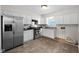 Modern kitchen with stainless steel appliances and white cabinets at 3125 N Tacoma Ave, Indianapolis, IN 46218