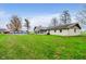 Backyard with above-ground pool, screened porch, and grassy lawn at 432 500 N, Anderson, IN 46012