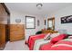 Bedroom featuring a cozy bed, dresser, vanity, and closet at 432 500 N, Anderson, IN 46012