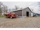 Exterior of large garage/barn with tractor, truck, and gravel driveway at 432 500 N, Anderson, IN 46012