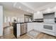 Modern kitchen with white cabinets, black countertops, stainless steel appliances, and an island at 432 500 N, Anderson, IN 46012