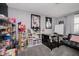 A home office with a desk, shelves, and comfortable seating at 432 500 N, Anderson, IN 46012
