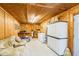 Tack room with cabinets, a couch, a small kitchen area, and storage space at 432 500 N, Anderson, IN 46012
