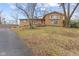 Brick ranch house with attached garage and landscaping at 4529 Dickson Rd, Indianapolis, IN 46226