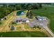 Aerial view of home, detached garage, pond, and surrounding land at 4832 E 200 N, Anderson, IN 46012