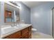 Bathroom with a double sink vanity, toilet, and shower at 4832 E 200 N, Anderson, IN 46012