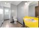 Bathroom with bright yellow countertop, toilet, and a separate shower area at 4832 E 200 N, Anderson, IN 46012