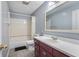 Bathroom with shower/tub combo, vanity with light countertop, and tile flooring at 4832 E 200 N, Anderson, IN 46012