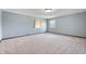 Vacant bedroom with light blue walls and neutral carpeting at 4832 E 200 N, Anderson, IN 46012