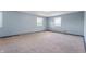 Empty bedroom featuring light blue walls and neutral carpeting at 4832 E 200 N, Anderson, IN 46012