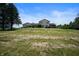 Two-story home with a large grassy yard and trees at 4832 E 200 N, Anderson, IN 46012