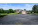 Exterior view of the home, driveway, and attached garage at 4832 E 200 N, Anderson, IN 46012