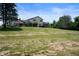 Backyard view of a two-story house with a spacious lawn and some trees at 4832 E 200 N, Anderson, IN 46012