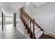 A staircase with wooden banister and carpeted steps at 4832 E 200 N, Anderson, IN 46012