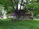 House exterior with stone accents and mature landscaping at 5120 Flintstone Dr, Indianapolis, IN 46237